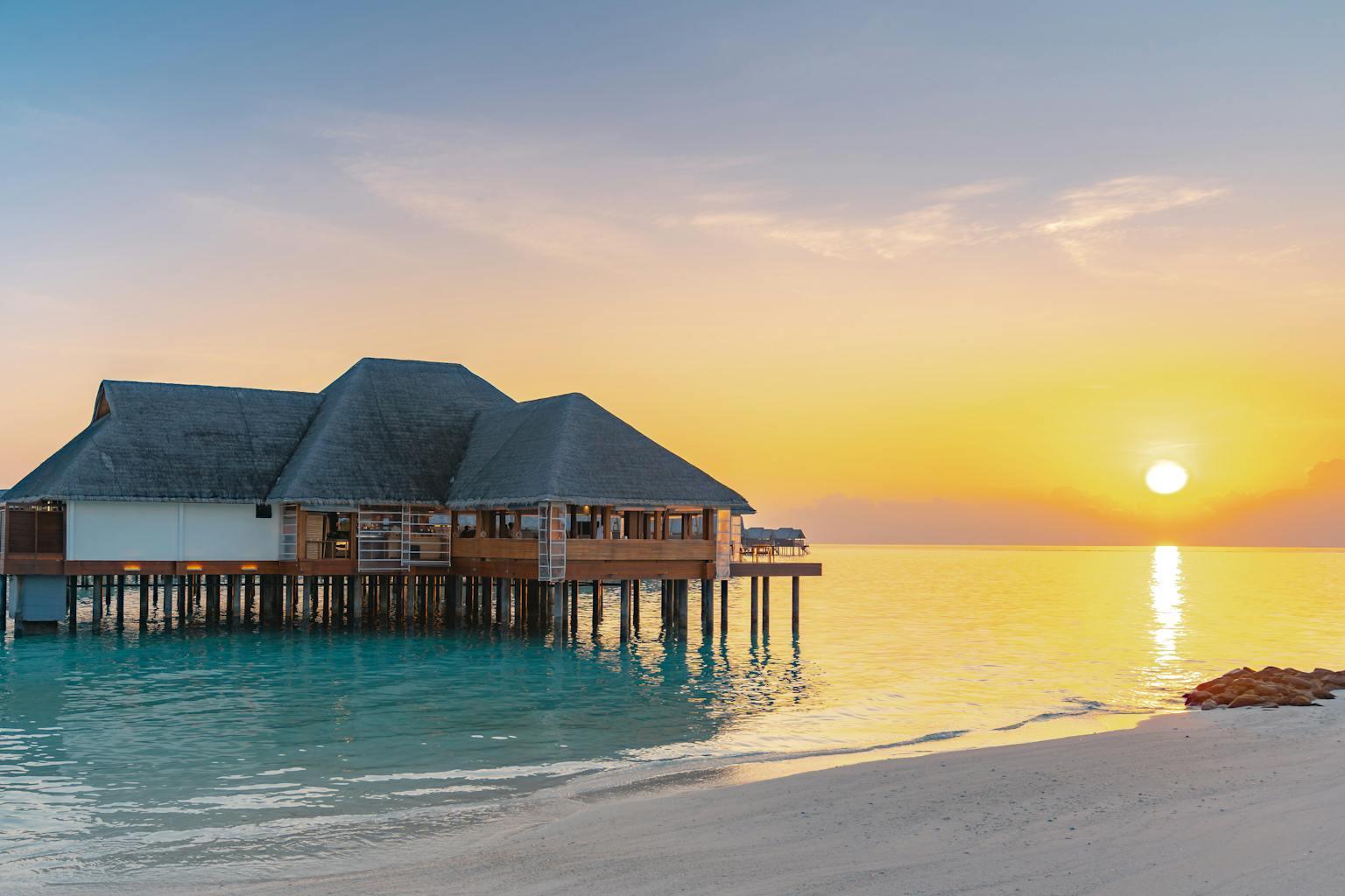 Secluded luxury overwater villa in Maldives with private deck.