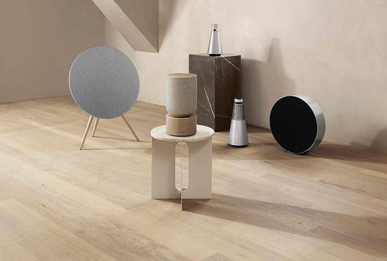 Bang & Olufsen speakers styled in a minimalist interior, including Beosound A9, Balance, and other sculptural audio pieces