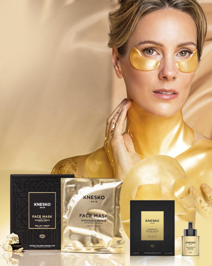 KNESKO Nanogold Repair Collection featuring a woman wearing gold under-eye masks, with gold-themed face masks, serum, and hydrogel mask displayed - luxury collagen skincare designed to firm, lift, and hydrate.